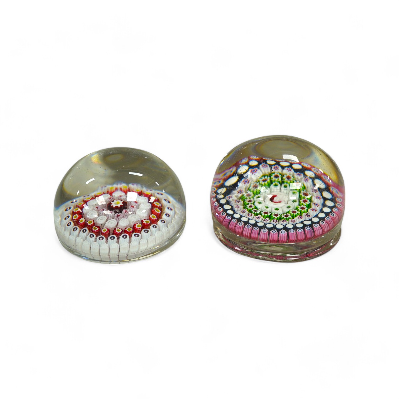 Two Victorian English millefiori glass paperweights, 7cm tall. Condition - fair to good